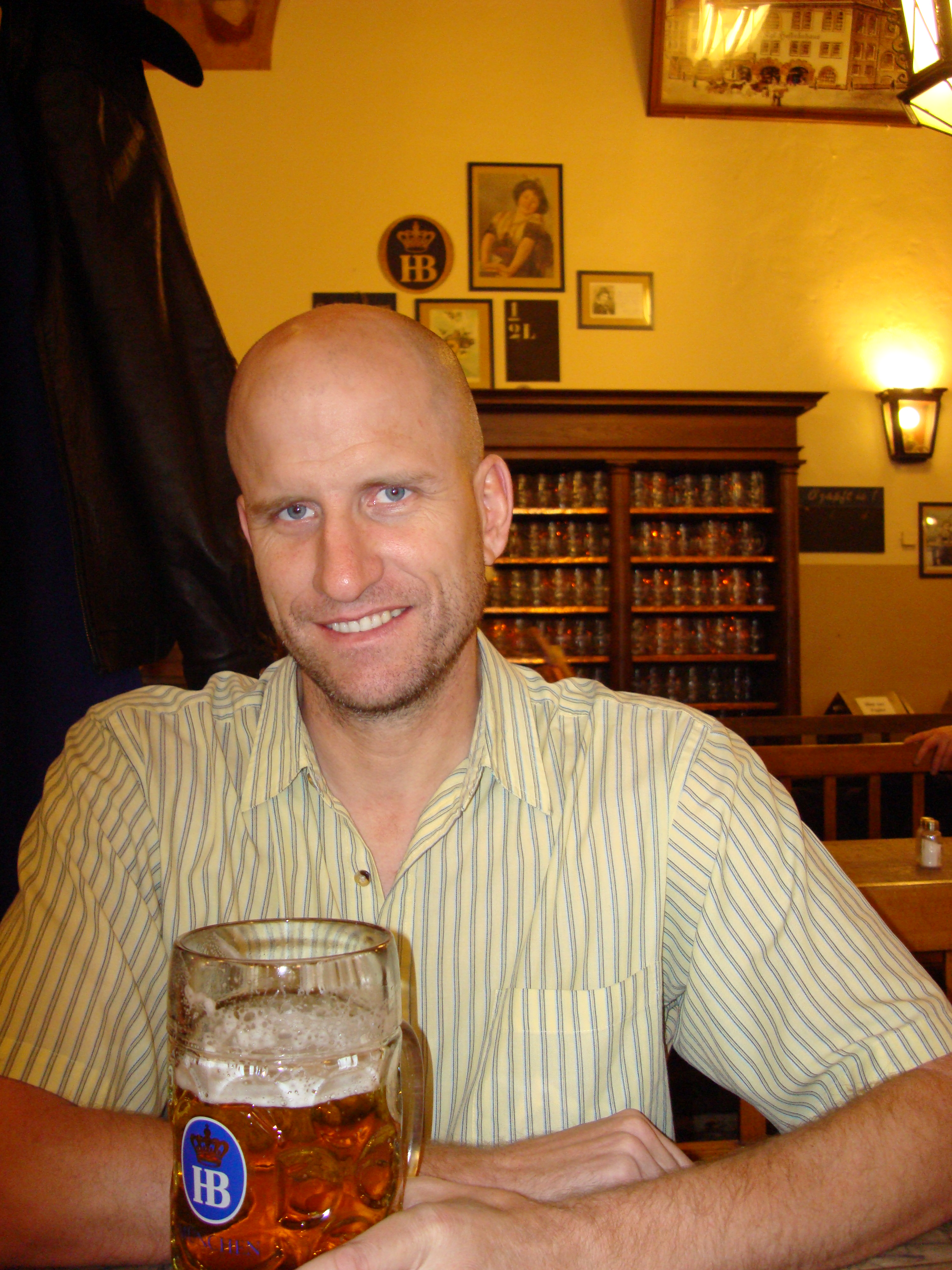 man at Hof Brau house with big beer germany