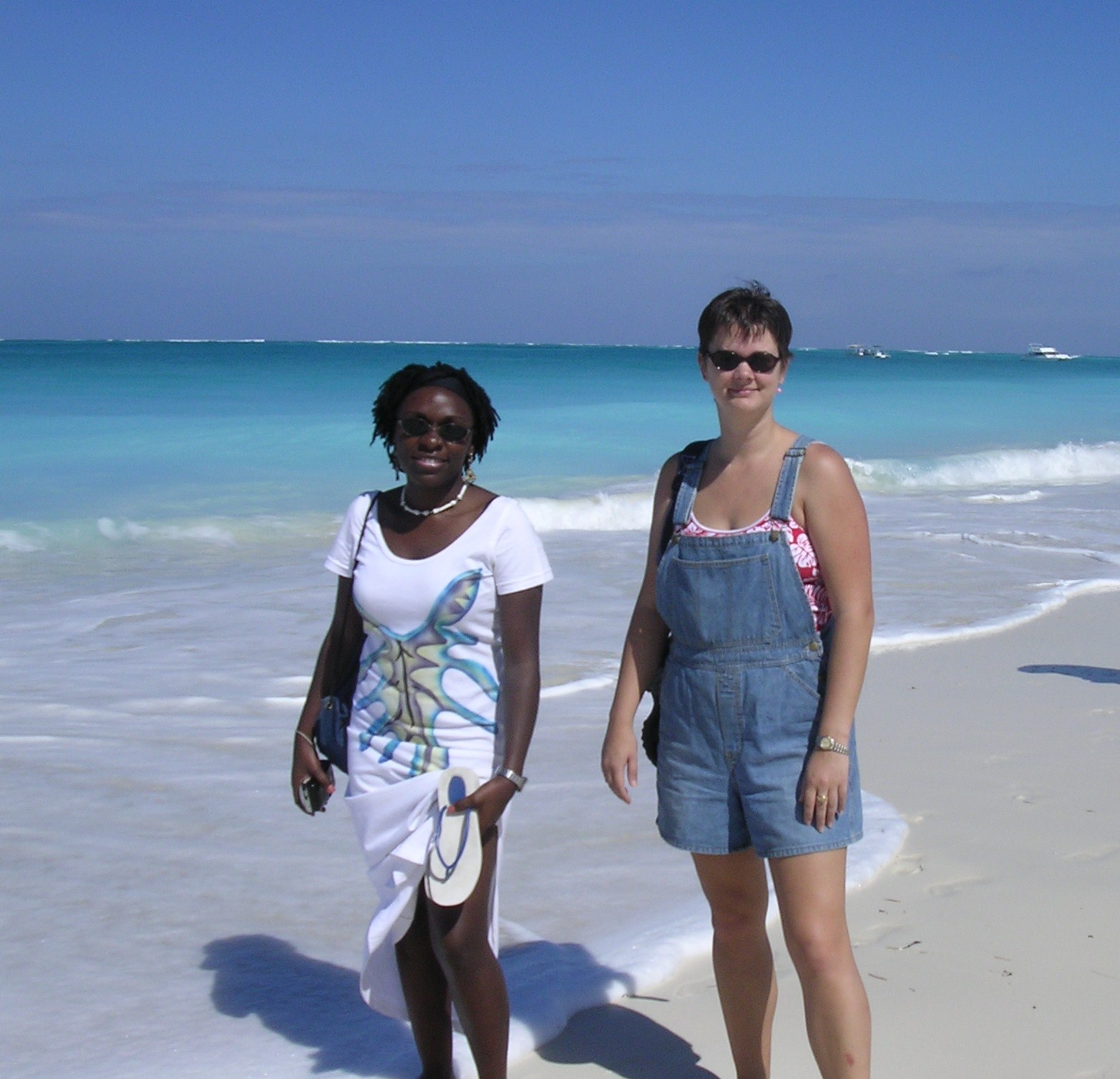 two friends on the beach at turks and caicos island
