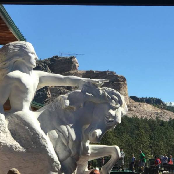 model and actual carving of Crazy Horse Memorial
